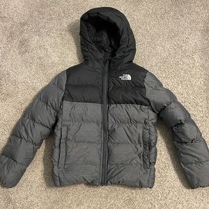 Size small (7/8) north face jacket for boys. Black and dark grey.